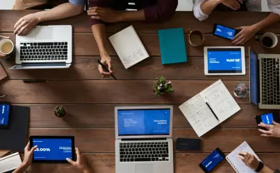 top view photo of people near wooden table 3183150